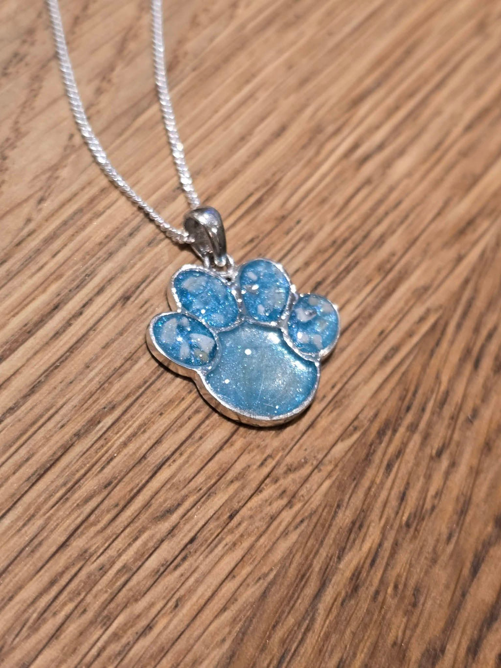 Silver paw print