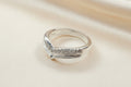 Solid silver wishbone style ring with CZ stones