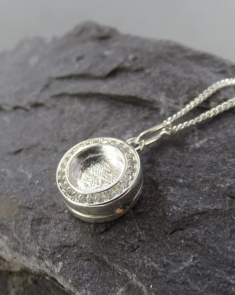 Small round solid silver locket