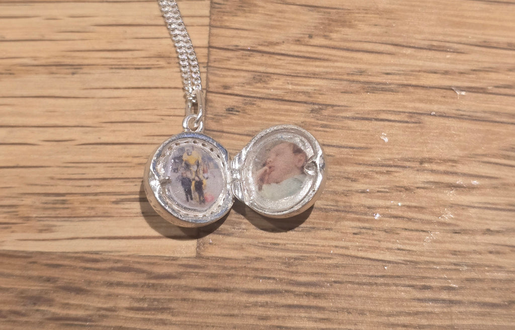 Small round solid silver locket