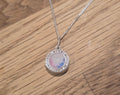 Small round solid silver locket
