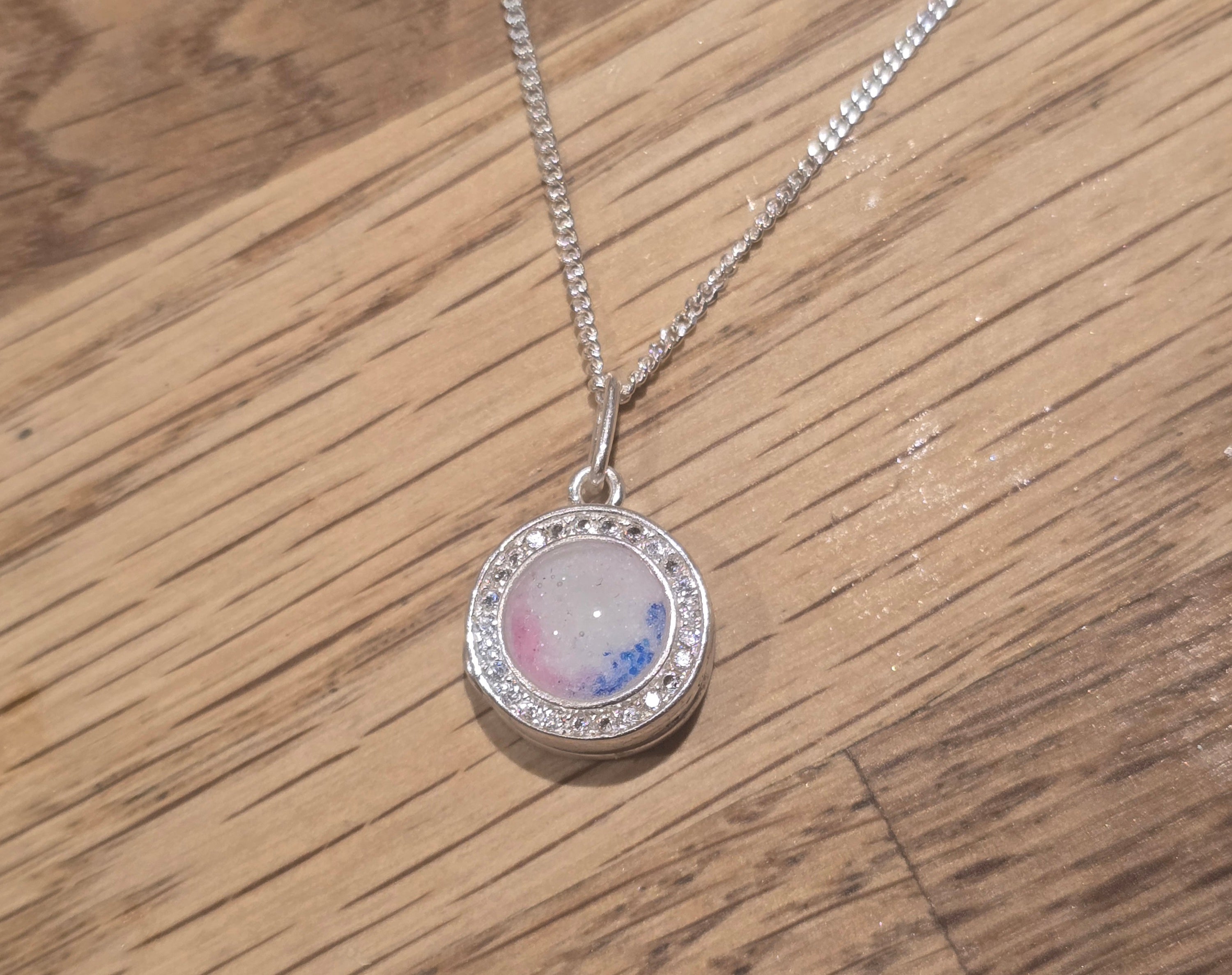 Small round solid silver locket