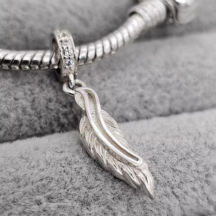 Feather dangle charm