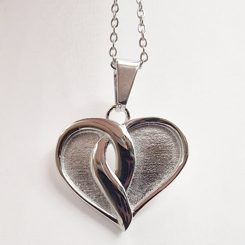 Stainless steel crossover heart pendant